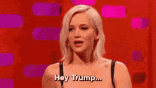 Jennifer Lawrence saying, 'Hey Trump...fuck you!' while giving the finger.